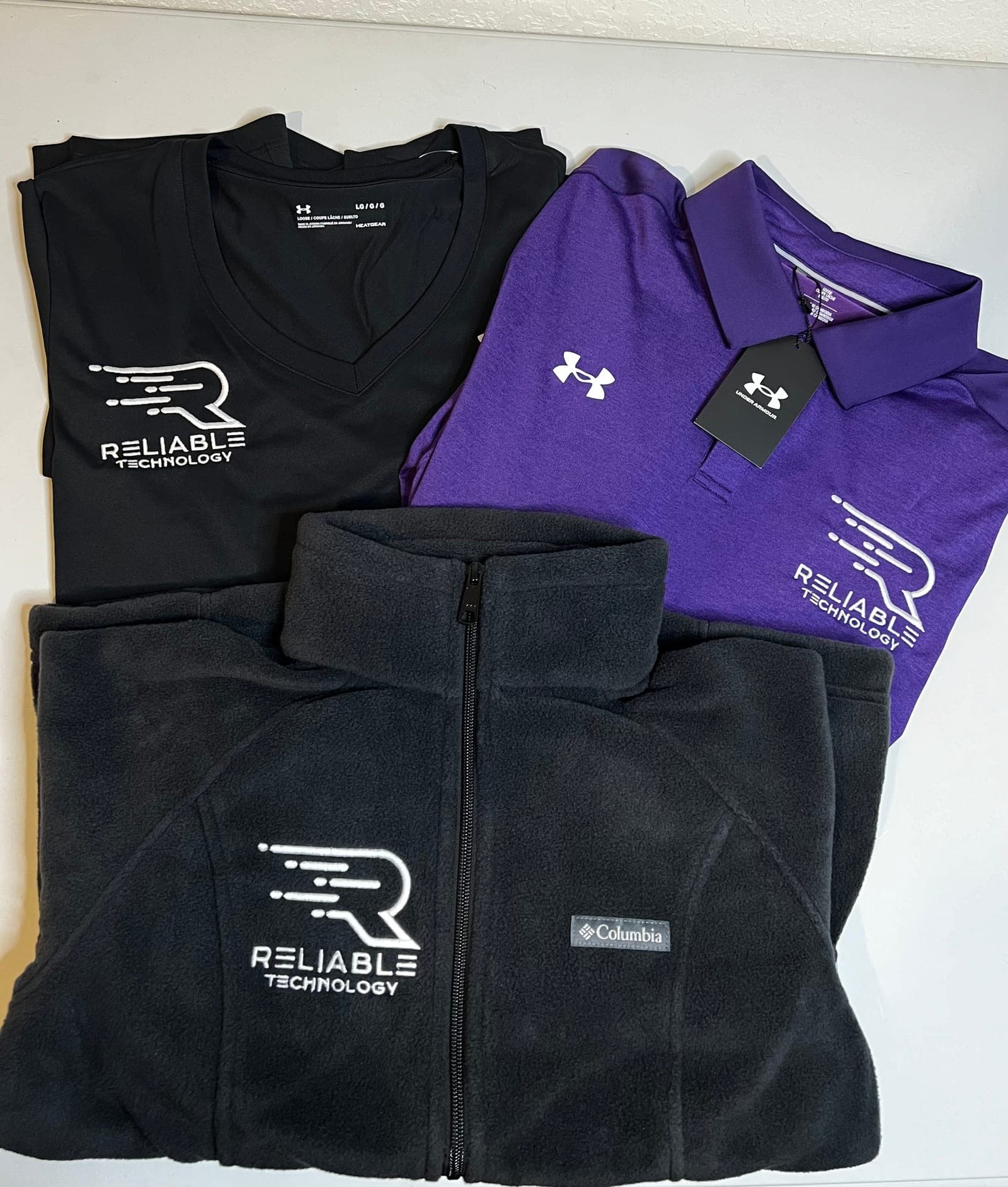 Embroidered polo, tee, and fleece jacket for Reliable Technology